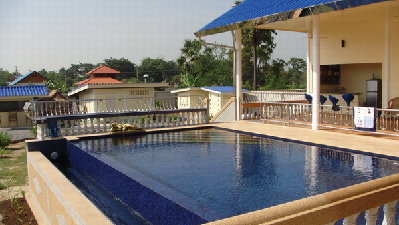 Pool with sauna and restaraunt in background